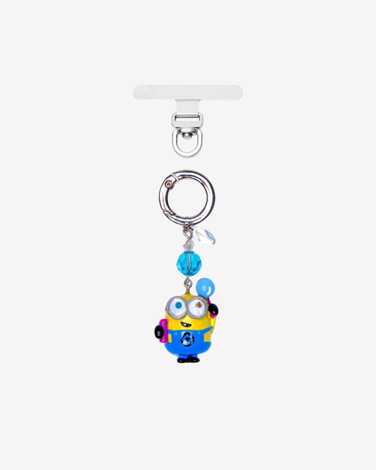 Yellow goggle-eyed character phone charm holding a blue balloon
