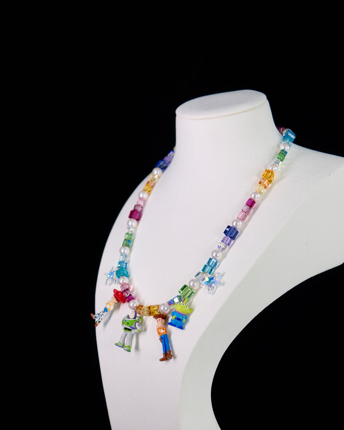 Rainbow Swarovski crystal beads and pearls close-up on handmade charm necklace by ShinoraStudio
