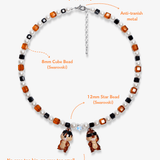 Close-up detail of Retro Sparkle Charm Necklace · handmade Swarovski crystal jewelry