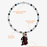 Lifestyle worn view of Cello Player Vintage Charm Swarovski Necklace · handmade Swarovski crystal jewelry