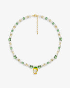 Handmade green and yellow Swarovski crystal and pearl charm necklace with vintage pendant - flat lay