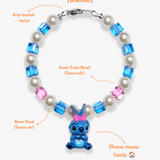 Close-up detail of Blue Bow Character Charm Bracelet · handmade Swarovski crystal jewelry