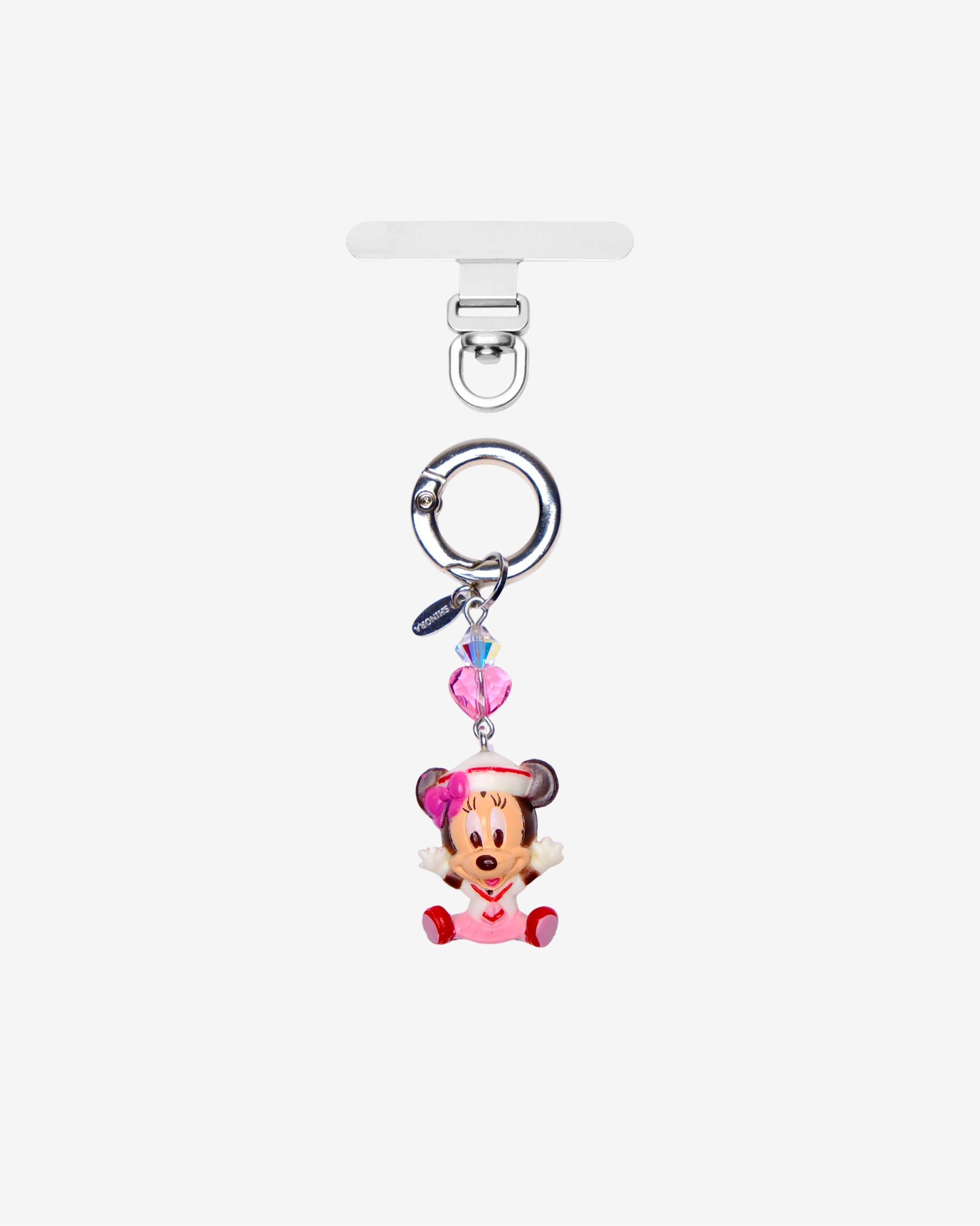 Mouse phone charm with a pink bow and pink crystal heart, shown with silver-tone attachment hardware on white.