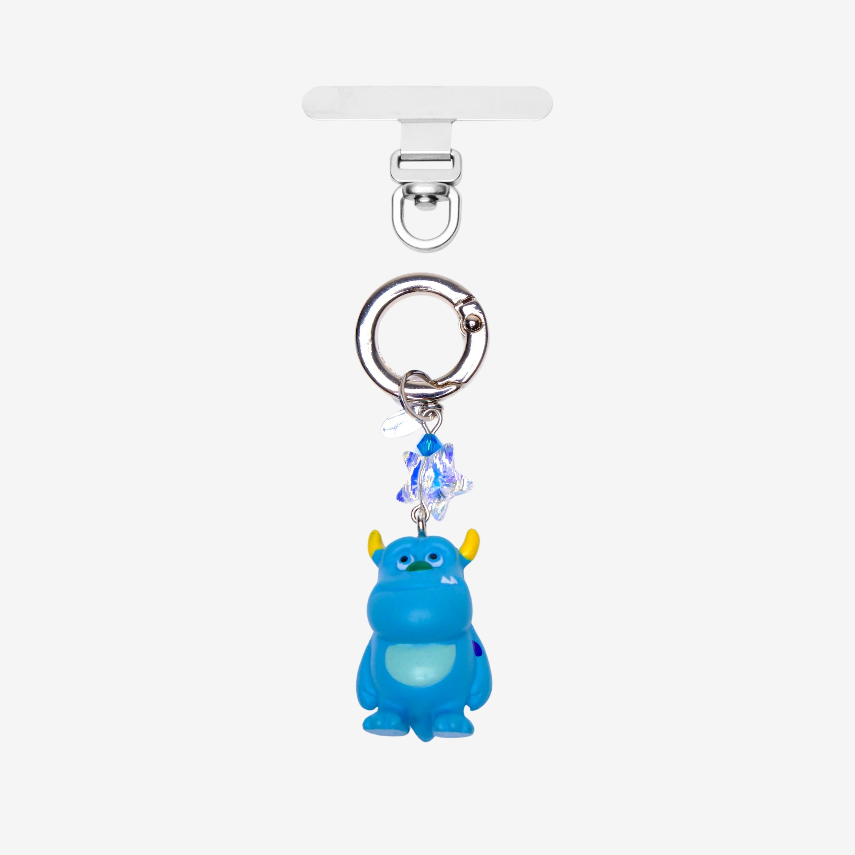 Blue horned monster phone charm with blue crystal accents and silver-tone attachment hardware, shown on white.