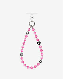 Pink crystal beaded phone chain with a black heart, dark geometric beads and silver-tone attachment rings.