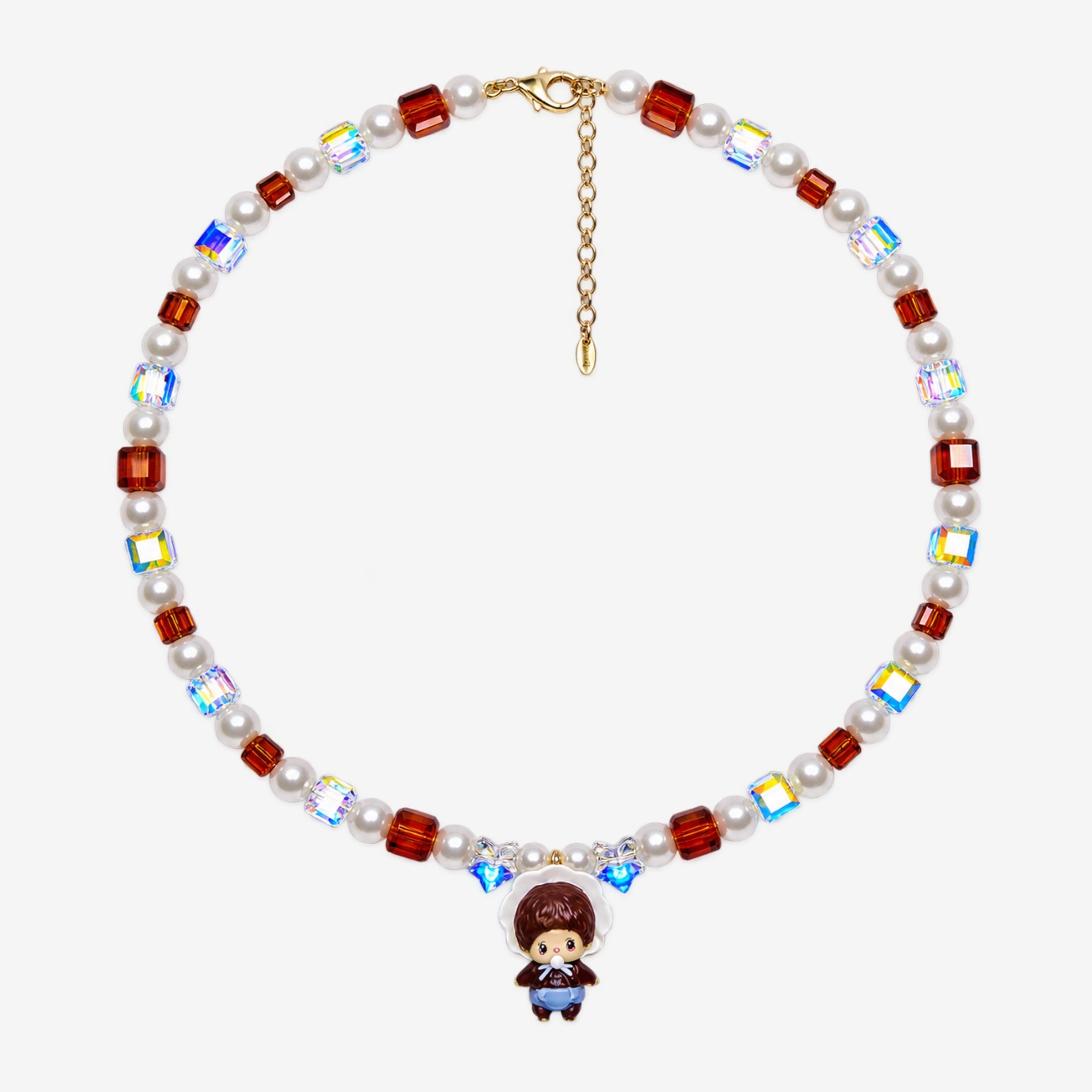 Amber-brown crystal and white pearl necklace with iridescent star beads, a bonnet-wearing doll charm and extension chain laid flat.