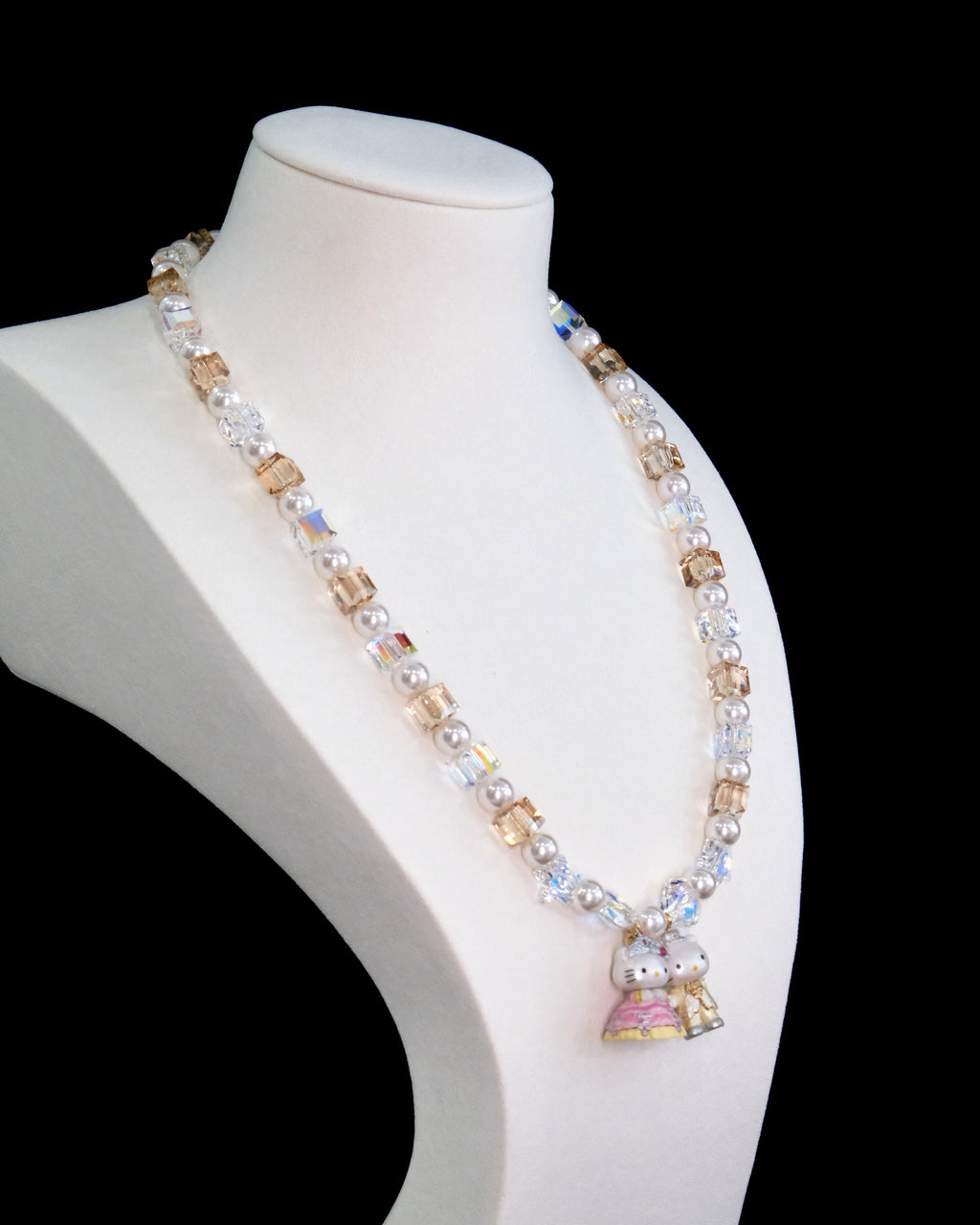 Model wearing handmade crystal charm necklace with Swarovski pearls - unique wedding jewelry