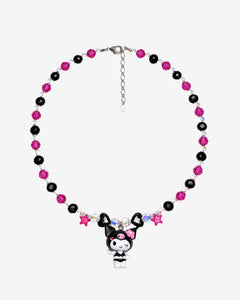 Pink and black crystal necklace with pink stars, black hearts, a winking character charm and silver extension chain laid flat.