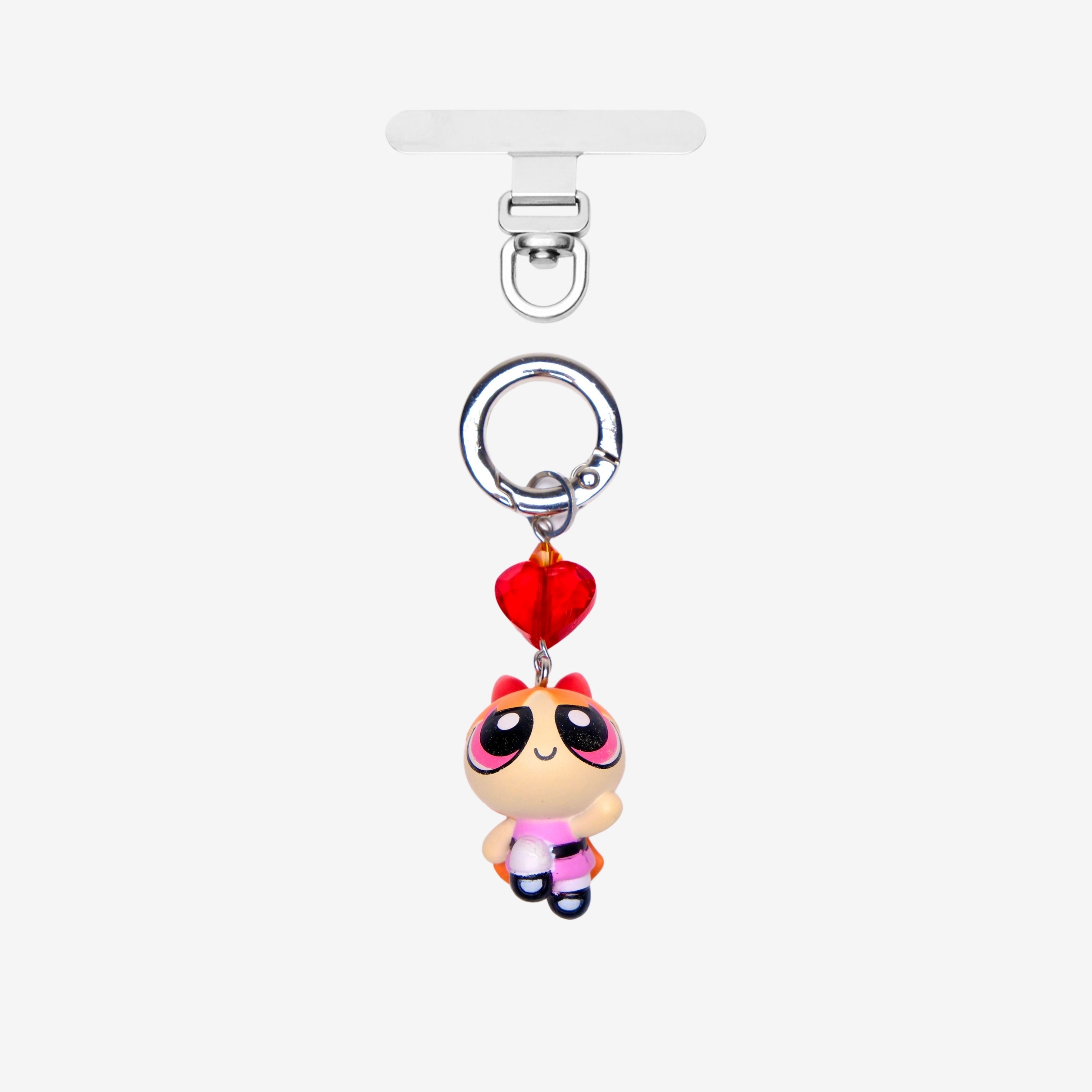 Detachable phone charm with a pink cartoon girl figure, red heart crystal, pink crystal accent and a silver-tone ring.