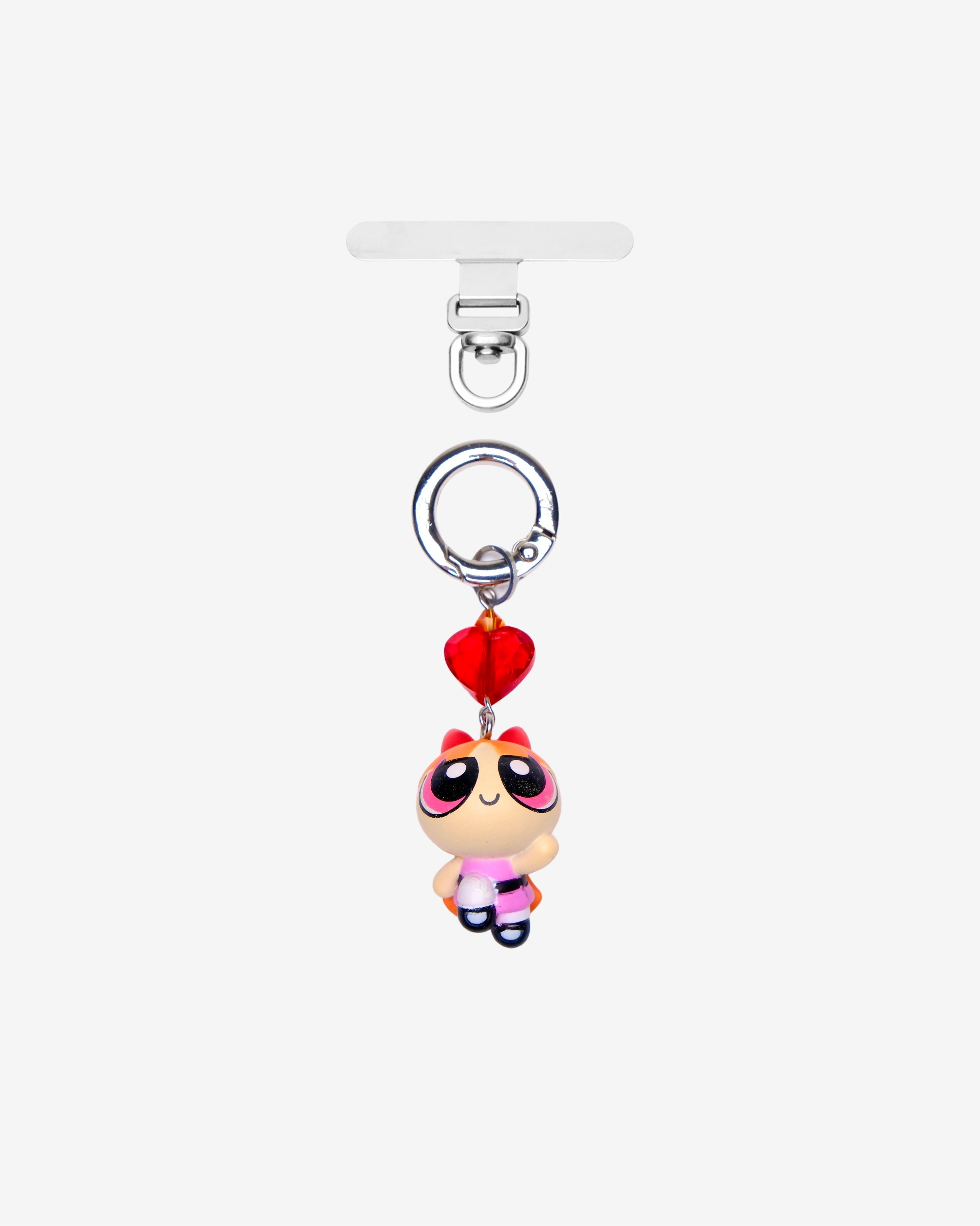 Detachable phone charm with a pink cartoon girl figure, red heart crystal, pink crystal accent and a silver-tone ring.