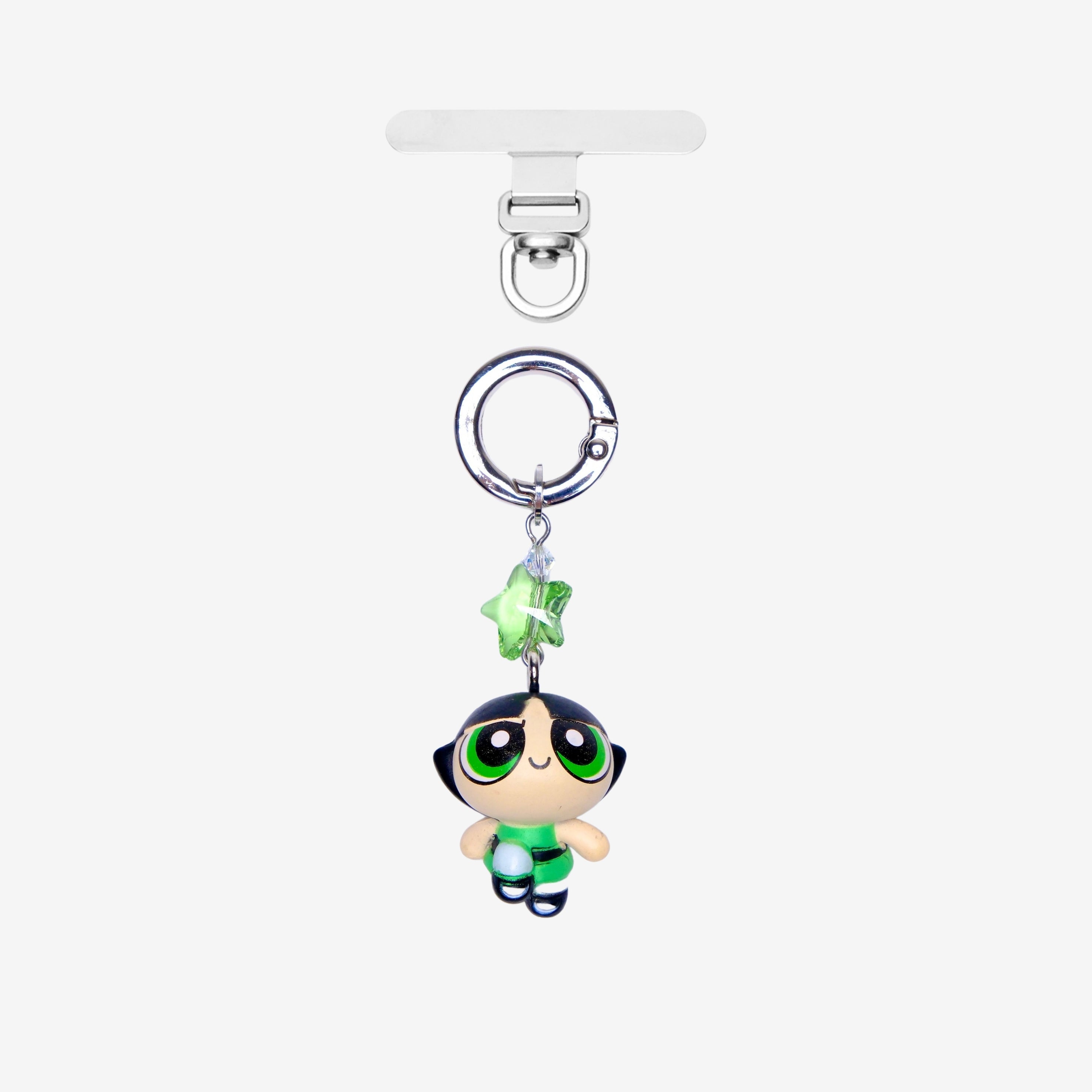 Detachable phone charm with a green cartoon girl figure, green star crystal, clear crystal accents and a silver-tone ring.
