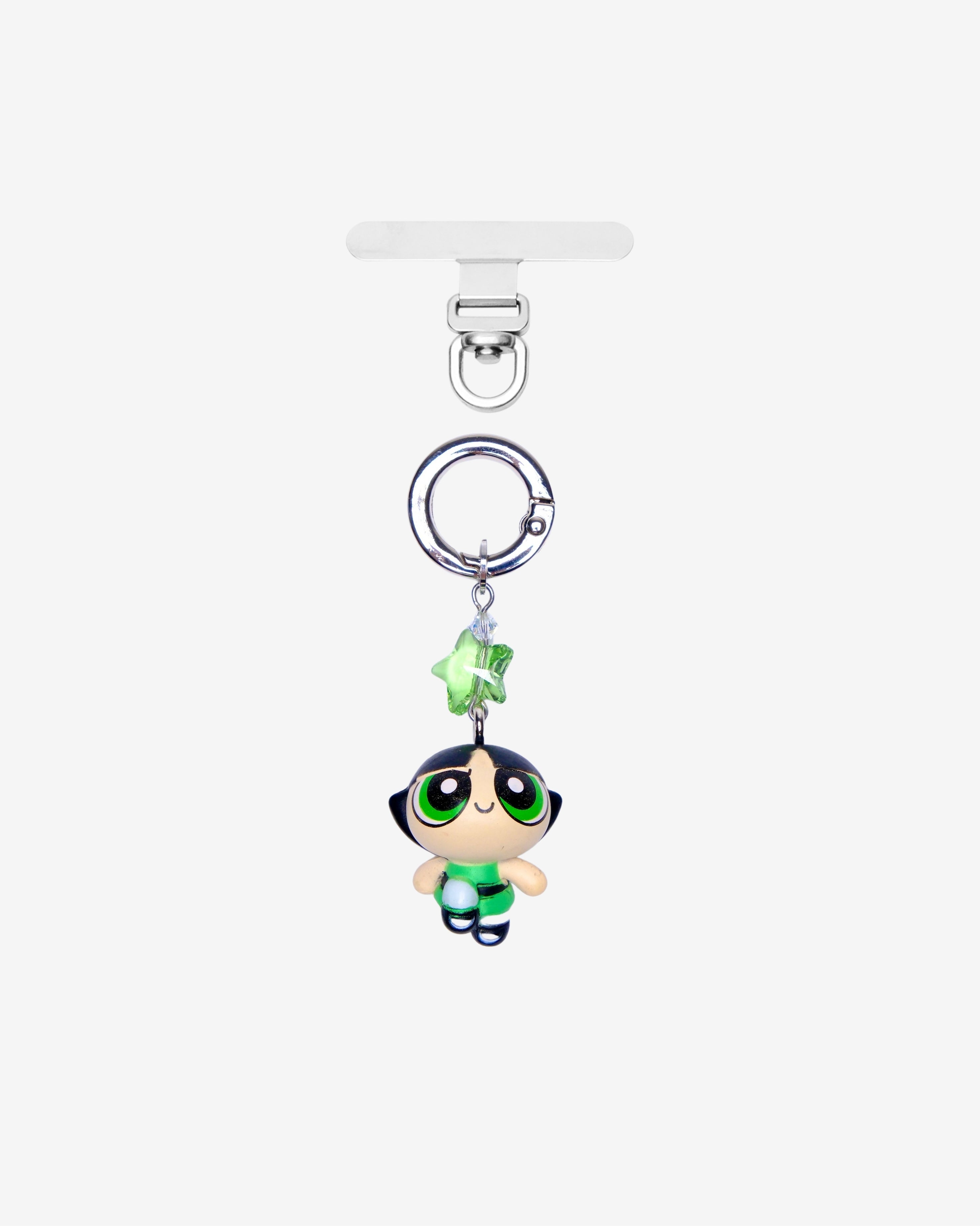 Detachable phone charm with a green cartoon girl figure, green star crystal, clear crystal accents and a silver-tone ring.