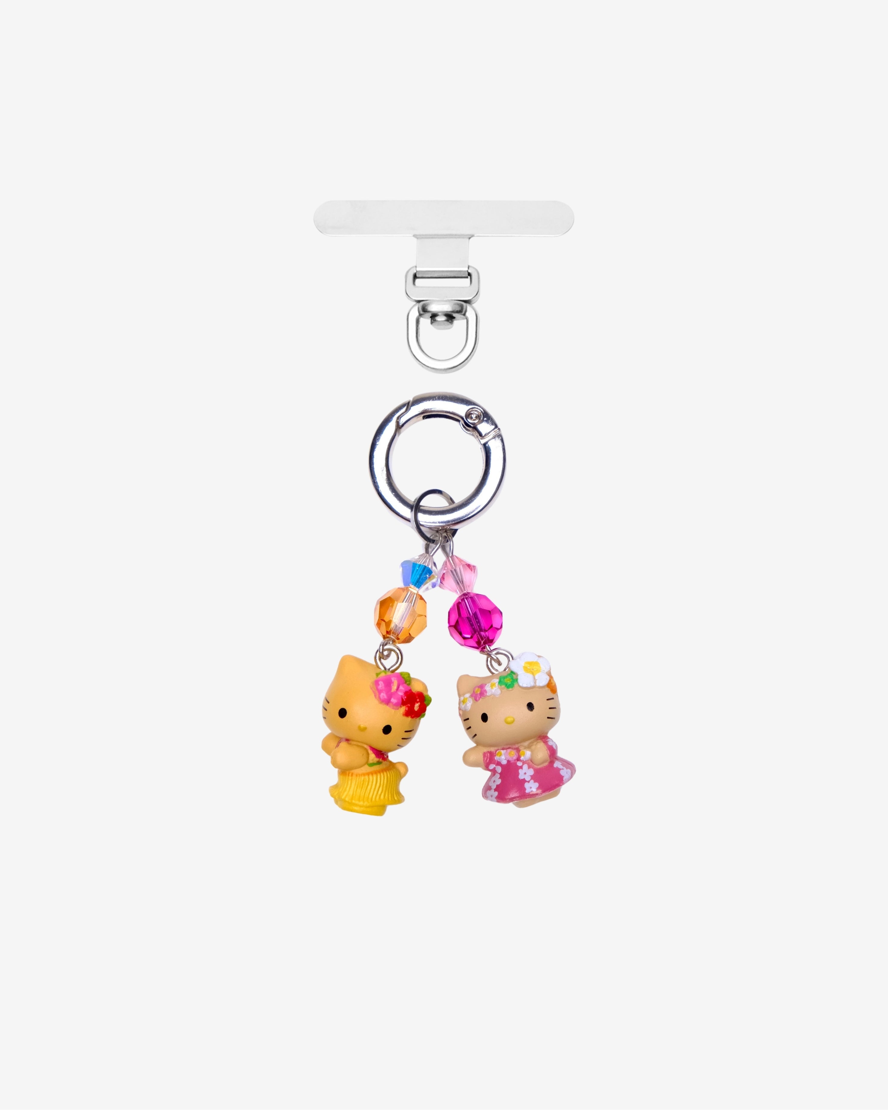 Two tropical cat phone charms in pink and yellow outfits with orange and pink crystals and silver-tone attachment hardware.