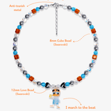 Close-up detail of Orange & Blue Duck Charm Necklace · handmade Swarovski crystal jewelry