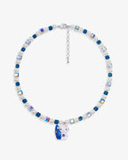 Handmade teal blue Swarovski crystal and pearl charm necklace with vintage pendant - flat lay