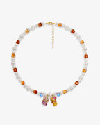 Handmade amber and white Swarovski crystal and pearl charm necklace with dual vintage pendants - flat lay