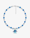 Handmade blue Swarovski crystal and pearl charm necklace with vintage pendant and cube beads - flat lay