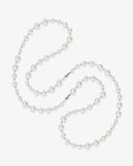 Handmade Swarovski pearl necklace opera length with graduating white pearls and silver chain - flat lay