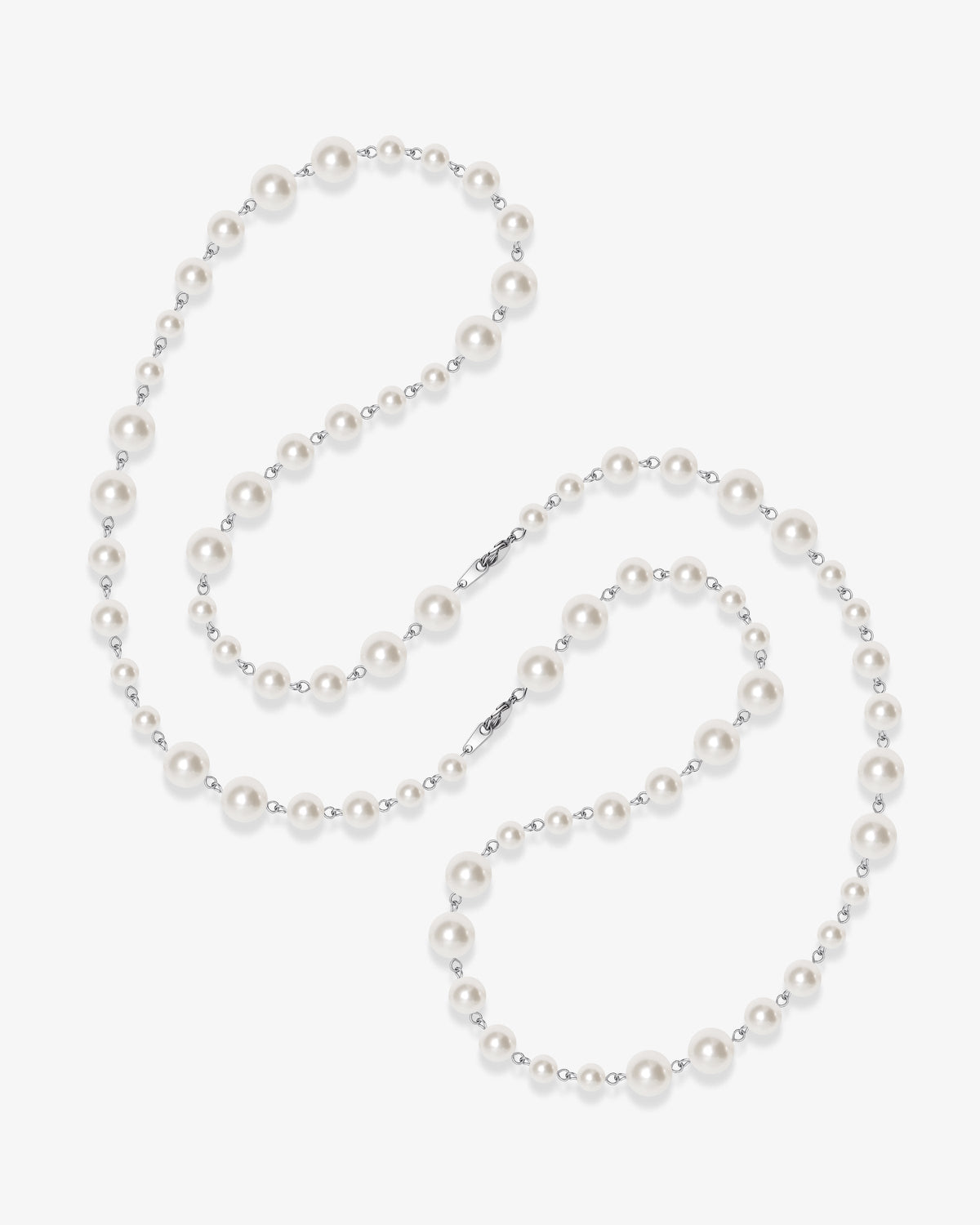 Handmade Swarovski pearl necklace opera length with graduating white pearls and silver chain - flat lay