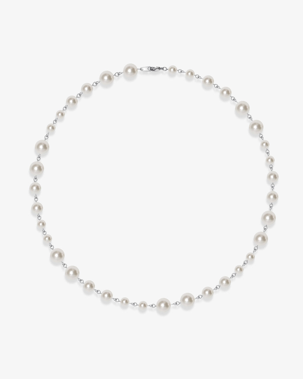 Handmade Swarovski pearl necklace petite length with white pearls and silver chain - flat lay