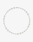 Handmade Swarovski pearl necklace petite length with white pearls and silver chain - flat lay