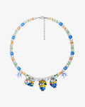 Handmade yellow Swarovski crystal and pearl charm necklace with three vintage pendants - flat lay