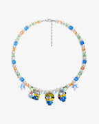 Handmade yellow Swarovski crystal and pearl charm necklace with three vintage pendants - flat lay