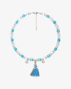 Handmade blue and silver Swarovski crystal and pearl charm necklace with vintage pendant - flat lay