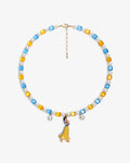 Handmade red blue and yellow Swarovski crystal and pearl charm necklace with vintage pendant - flat lay