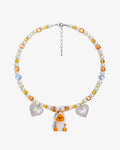 Handmade yellow and amber Swarovski crystal and pearl charm necklace with vintage pendant - flat lay