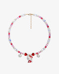 Handmade pink and ruby Swarovski crystal charm necklace with pearl hearts and vintage pendant - flat lay