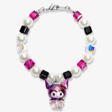 Studio product photo of a handmade purple Swarovski crystal charm bracelet with pearls and vintage-inspired charm details.