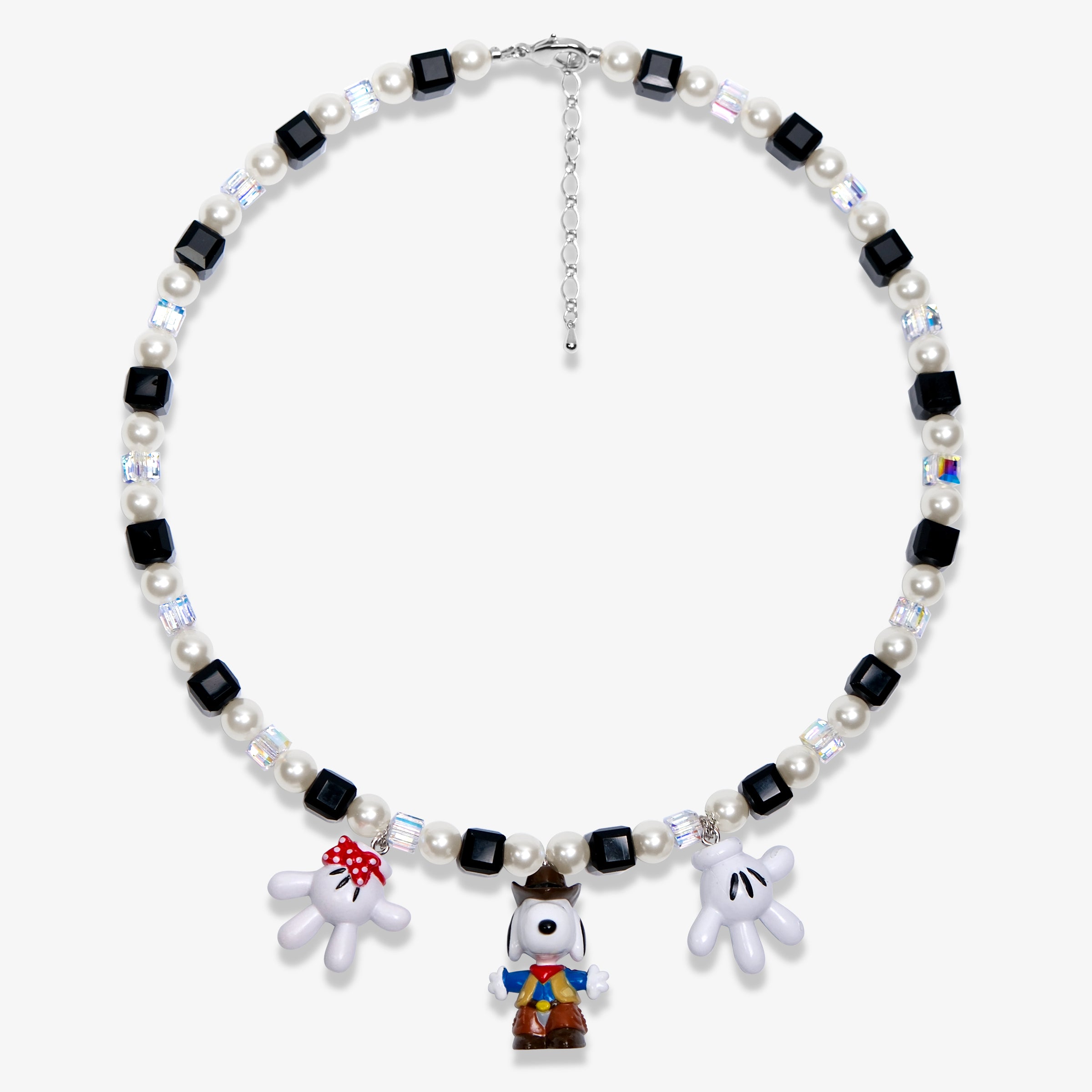 Studio product photo of a handmade colorful Swarovski crystal charm necklace with pearls and vintage-inspired charm details.