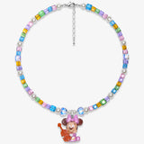 Studio product photo of a handmade rainbow Swarovski crystal charm necklace with pearls and vintage-inspired charm details.