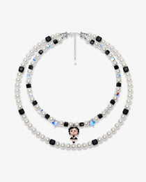 Double-layer handmade Swarovski crystal charm necklace with white pearls, black cube crystals, iridescent star crystals, and vintage starlet charm.