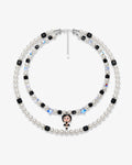 Double-layer handmade Swarovski crystal charm necklace with white pearls, black cube crystals, iridescent star crystals, and vintage starlet charm.