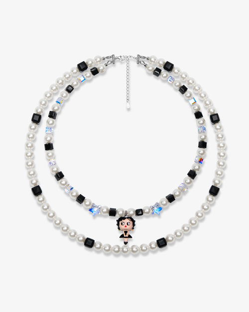 Double-layer handmade Swarovski crystal charm necklace with white pearls, black cube crystals, iridescent star crystals, and vintage starlet charm.
