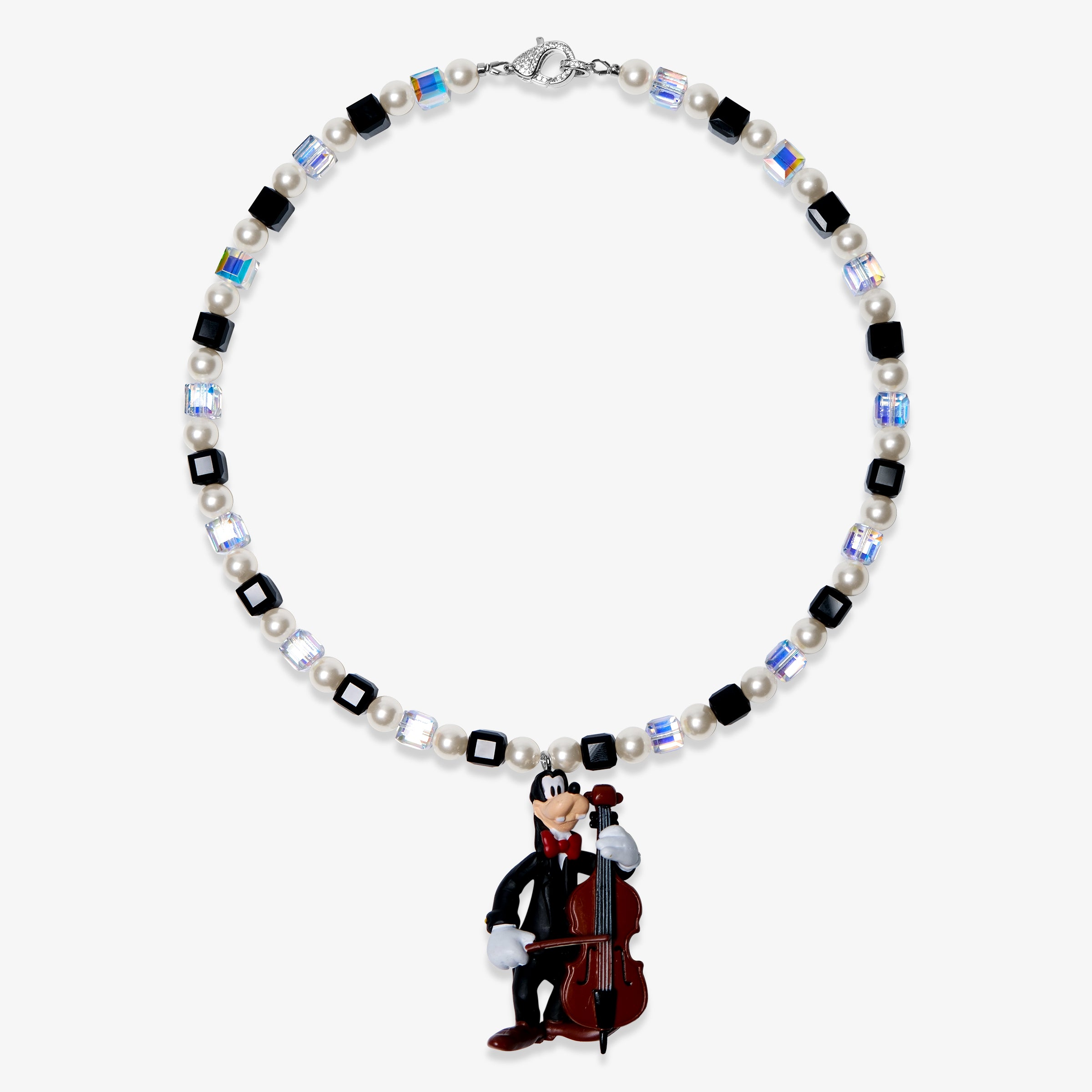 Studio product photo of a handmade black pearl charm necklace with Swarovski crystal beads and a vintage-inspired cello-player pendant.