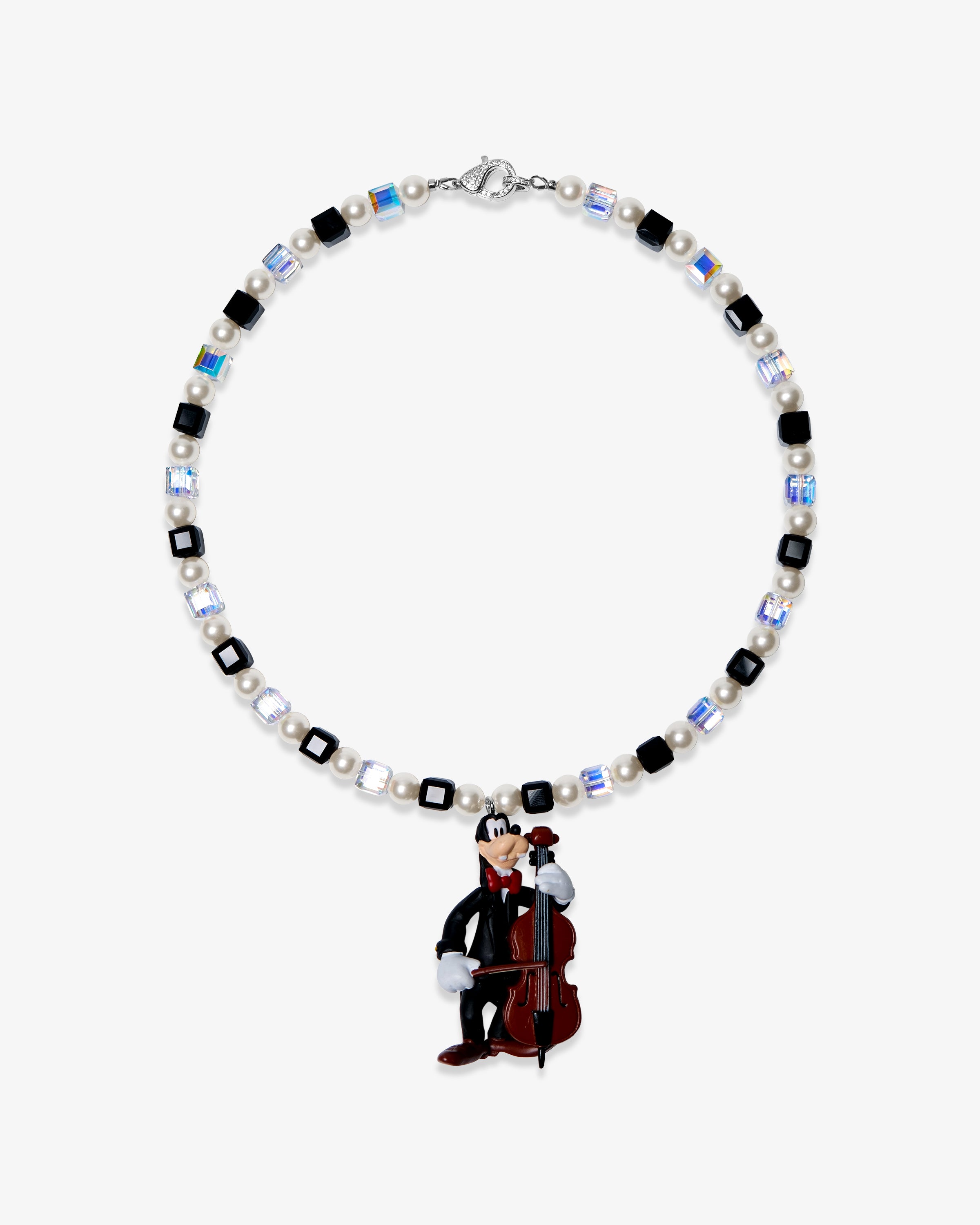 Studio product photo of a handmade black pearl charm necklace with Swarovski crystal beads and a vintage-inspired cello-player pendant.