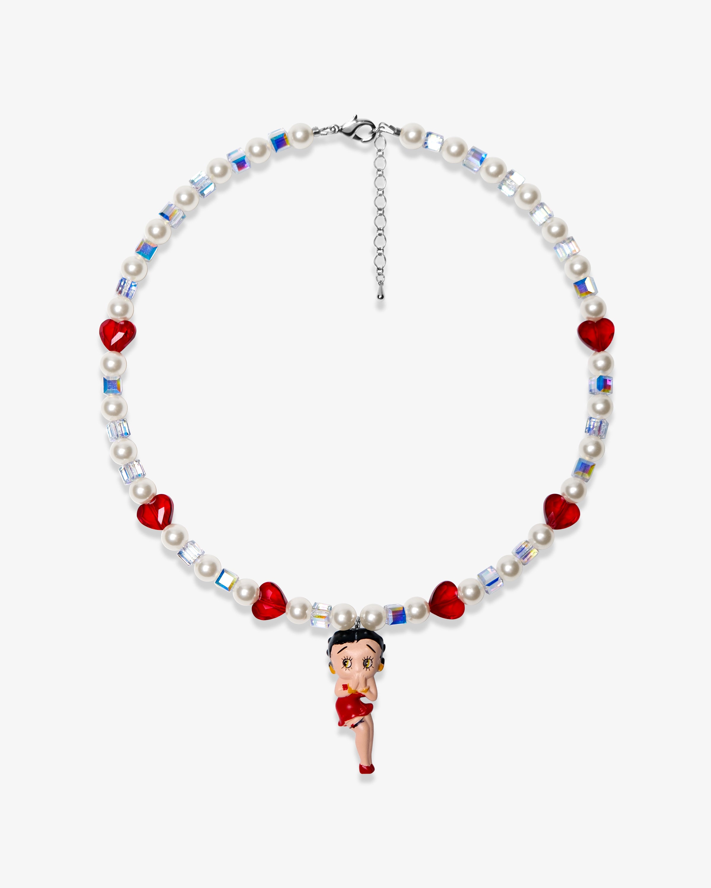 Studio product photo of a handmade red heart charm necklace with white Swarovski crystal pearls and iridescent cube beads.