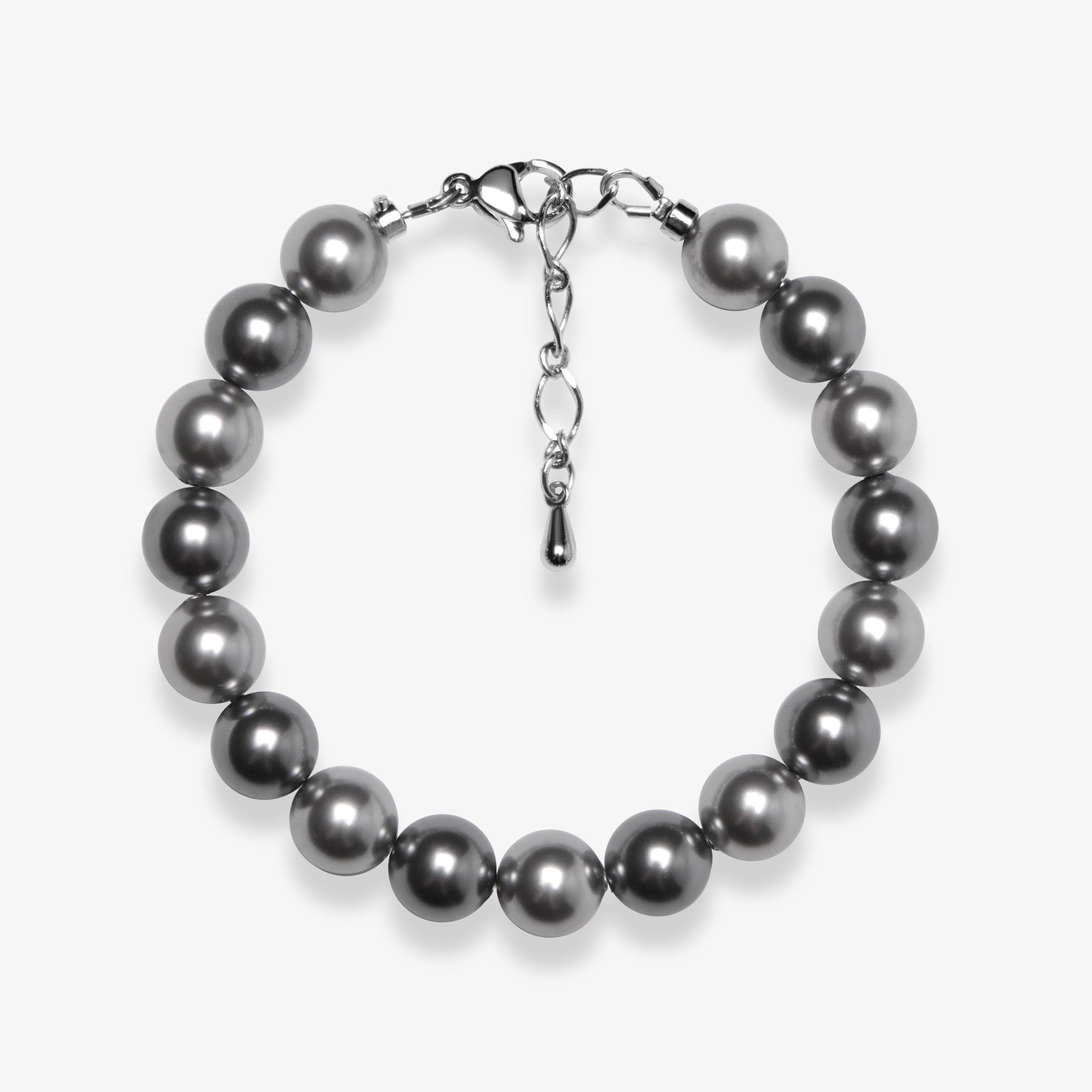 Studio product photo of a handmade charcoal gray Swarovski pearl bracelet with a silver clasp and adjustable extender chain.