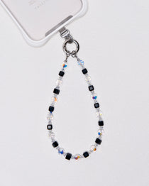 Detail view showing Black Swarovski crystal phone chain with silver-tone phone hardware.