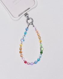 Detail view showing Rainbow Swarovski crystal phone chain with multicolor crystals and silver-tone phone hardware.