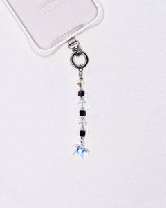 Product photo showing Black Swarovski crystal straight phone chain with a star charm and silver-tone phone hardware.