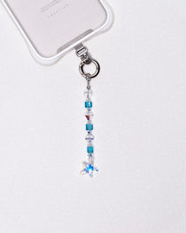 Product photo showing Blue Swarovski crystal straight phone chain with a star charm and silver-tone phone hardware.