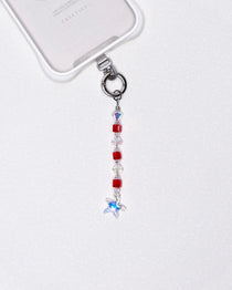 Product photo showing Red Swarovski crystal straight phone chain with a star charm and silver-tone phone hardware.