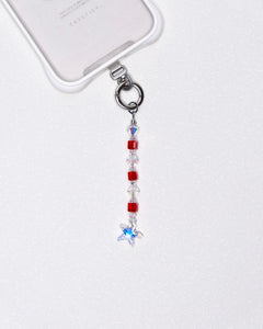 Product photo showing Red Swarovski crystal straight phone chain with a star charm and silver-tone phone hardware.