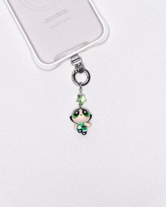 Product photo showing Green character-inspired phone charm with a green crystal accent and silver-tone phone hardware.