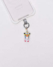 Product photo showing Vintage yellow unicorn-inspired phone charm with pink and blue crystal accents and silver-tone phone hardware.