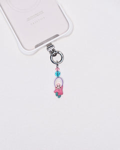 Product photo showing Pink character-inspired phone charm with pink and blue crystal accents and silver-tone phone hardware.